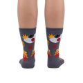 Rear view of the socks on a person's legs, showcasing the full design.
