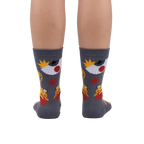 Rear view of the socks on a person's legs, showcasing the full design.