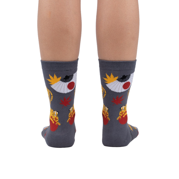 Rear view of the socks on a person's legs, showcasing the full design.