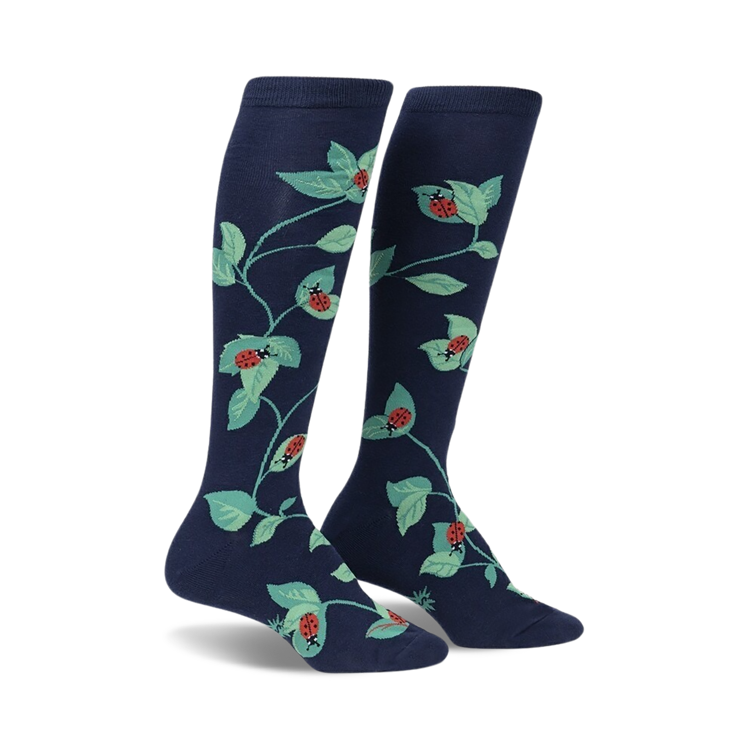 Pair of navy blue knee-high socks with a repeating pattern of ladybugs and green leaves.