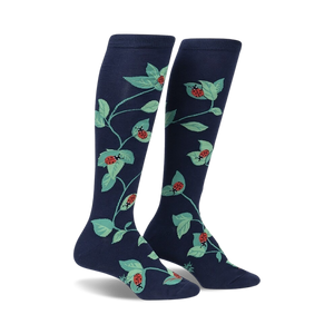 women's dark blue stretch-it knee high socks feature all-over pattern of green leaves and red ladybugs.   