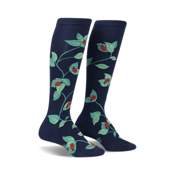 women's dark blue stretch-it knee high socks feature all-over pattern of green leaves and red ladybugs.   