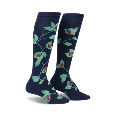 women's dark blue stretch-it knee high socks feature all-over pattern of green leaves and red ladybugs.   