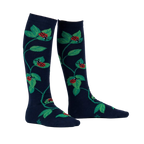 Close-up of 'Luck Be a Lady Bug' socks on a person's legs, showcasing the design and fit.