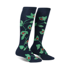 Pair of navy blue knee-high socks with a whimsical pattern of ladybugs and green leaves climbing a vine.