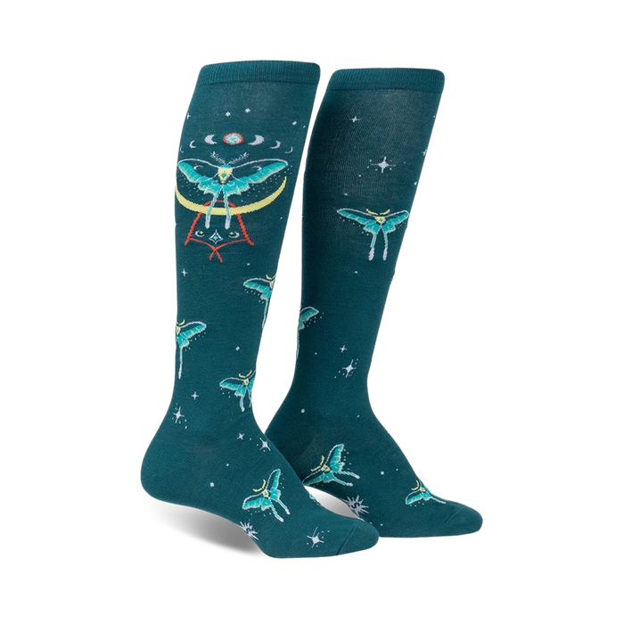 dark teal knee-high women's socks feature moths, moons, and stars pattern.   }}