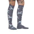 Lifestyle shot: Model wearing the 'Rolling With My Ponies' knee-high socks, showing the fit and pattern on the leg.