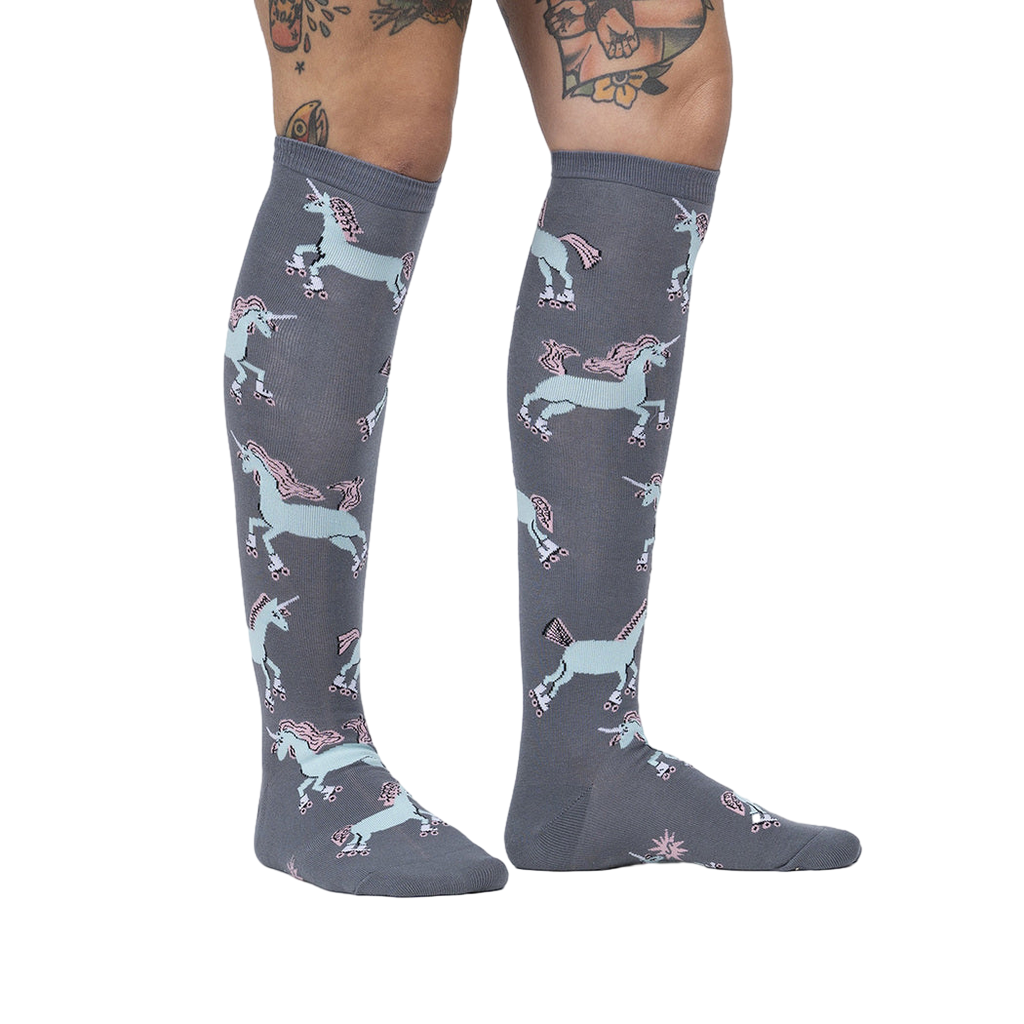 Lifestyle shot: Model wearing the 'Rolling With My Ponies' knee-high socks, showing the fit and pattern on the leg.