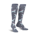 Pair of grey knee-high socks with a repeating pattern of pastel pink and blue roller-skating unicorns.