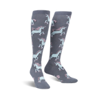 Pair of grey knee-high socks with a repeating pattern of pastel pink and blue roller-skating unicorns.