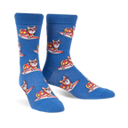 Pair of blue crew socks with repeating pattern of corgis wearing colorful shirts and surfing. 