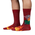 Lifestyle shot of a person's legs wearing the Dumpster Fire socks; showcases the fit and design on a model.