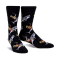 Pair of black crew socks featuring a repeating pattern of gladiators riding sharks.  The gladiators are depicted in gold, red, and white.