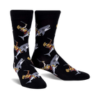 Pair of black crew socks featuring a repeating pattern of gladiators riding sharks.  The gladiators are depicted in gold, red, and white.