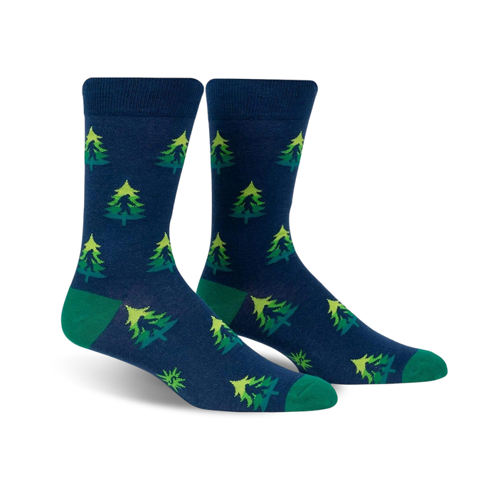 mens dark blue crew socks featuring forest green pine trees pattern with green toes and heels. perfect for casual wear.   }}