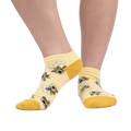 Lifestyle photo showing the socks on a person's feet against a white background.