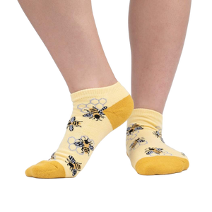 Lifestyle photo showing the socks on a person's feet against a white background.