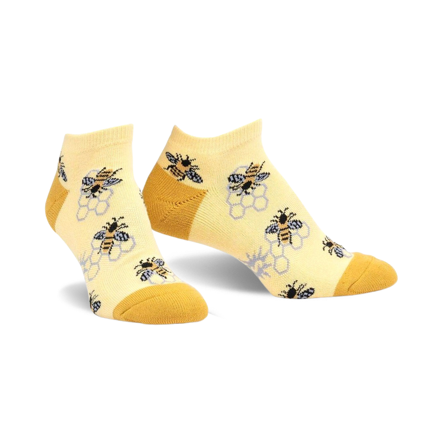 Pair of pastel yellow ankle socks with a pattern of bees and honeycombs.  The socks have a mustard yellow heel and toe.