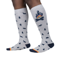 Lifestyle shot of a person wearing the Magic Of The Forest knee-high socks, showcasing the design and fit.