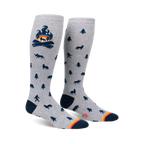 Knee-high socks in grey with a campfire and woodland creature design.  Dark blue and orange accents.