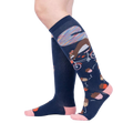 Lifestyle shot showing the 'Feeling Squirrelly' knee-high socks on a person's legs against a light gray background.