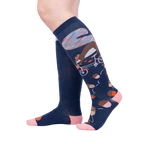 Lifestyle shot showing the 'Feeling Squirrelly' knee-high socks on a person's legs against a light gray background.