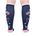 Rear view of the 'Feeling Squirrelly' knee-high socks on a person's legs, highlighting the full design on both socks.