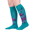 Lifestyle shot showcasing 'A Fan-tastic Tail' knee-high socks on a model's legs against a light gray background.