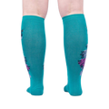 Rear view of teal knee-high socks, showcasing the full peacock design on the back of the socks.
