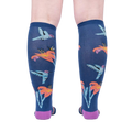 Back view of the Hmmmmmingbird socks on a person's legs.  Shows the full design repeat on the back of the socks.
