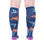 Back view of the Hmmmmmingbird socks on a person's legs.  Shows the full design repeat on the back of the socks.