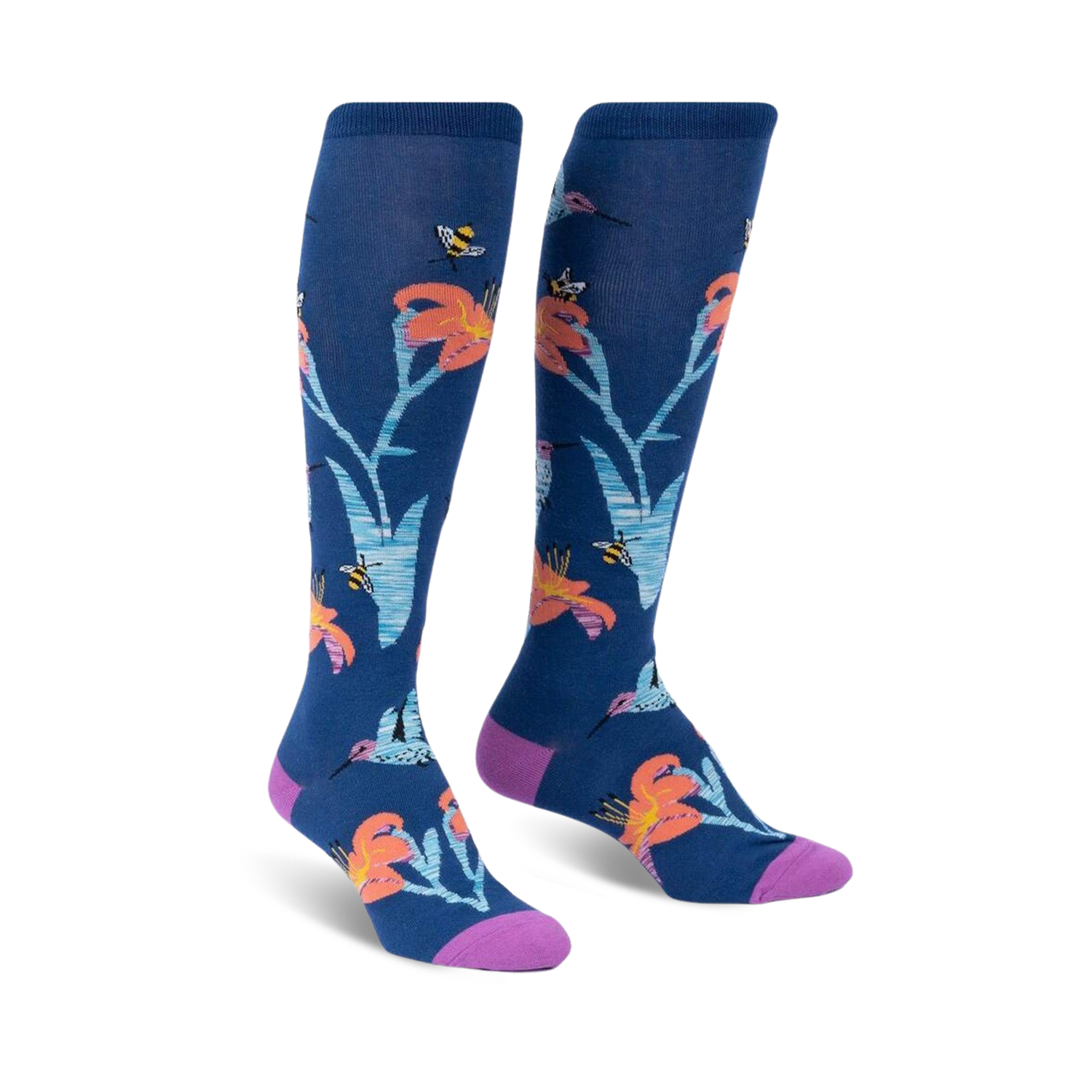 Pair of knee-high socks in navy blue.  Features a whimsical design of orange lilies, hummingbirds, and bees.