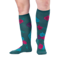 Lifestyle shot showing 'Bring the Bling' knee-high socks on a person's legs against a light grey background.
