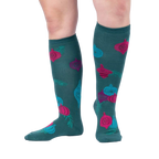 Lifestyle shot showing 'Bring the Bling' knee-high socks on a person's legs against a light grey background.