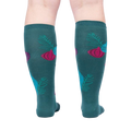 Rear view of 'Bring the Bling' knee-high socks on a person's legs against a light grey background.