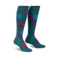 Pair of teal knee-high socks adorned with pink, teal, and blue ornaments and green sprigs.