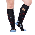 Lifestyle photo showcasing Thoracic Park socks on a person's legs, highlighting the fit and design.