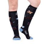 Lifestyle photo showcasing Thoracic Park socks on a person's legs, highlighting the fit and design.