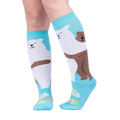 Lifestyle shot: Woman's legs wearing the 'Beary Best Friends' knee-high socks, showcasing the design and fit.