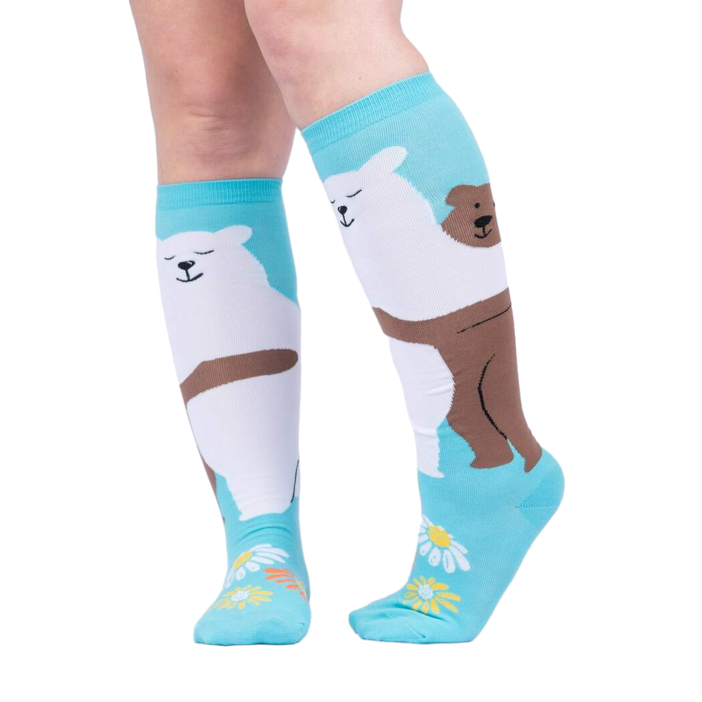 Lifestyle shot: Woman's legs wearing the 'Beary Best Friends' knee-high socks, showcasing the design and fit.