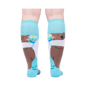 Back view of the socks, highlighting the bear and flower design on the back of the socks.