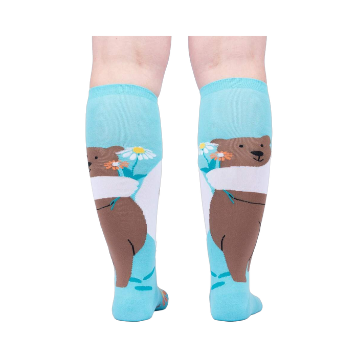 Back view of the socks, highlighting the bear and flower design on the back of the socks.