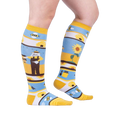 Lifestyle shot: A model's legs wearing the 'Honey, You're a Keeper' knee-high socks.