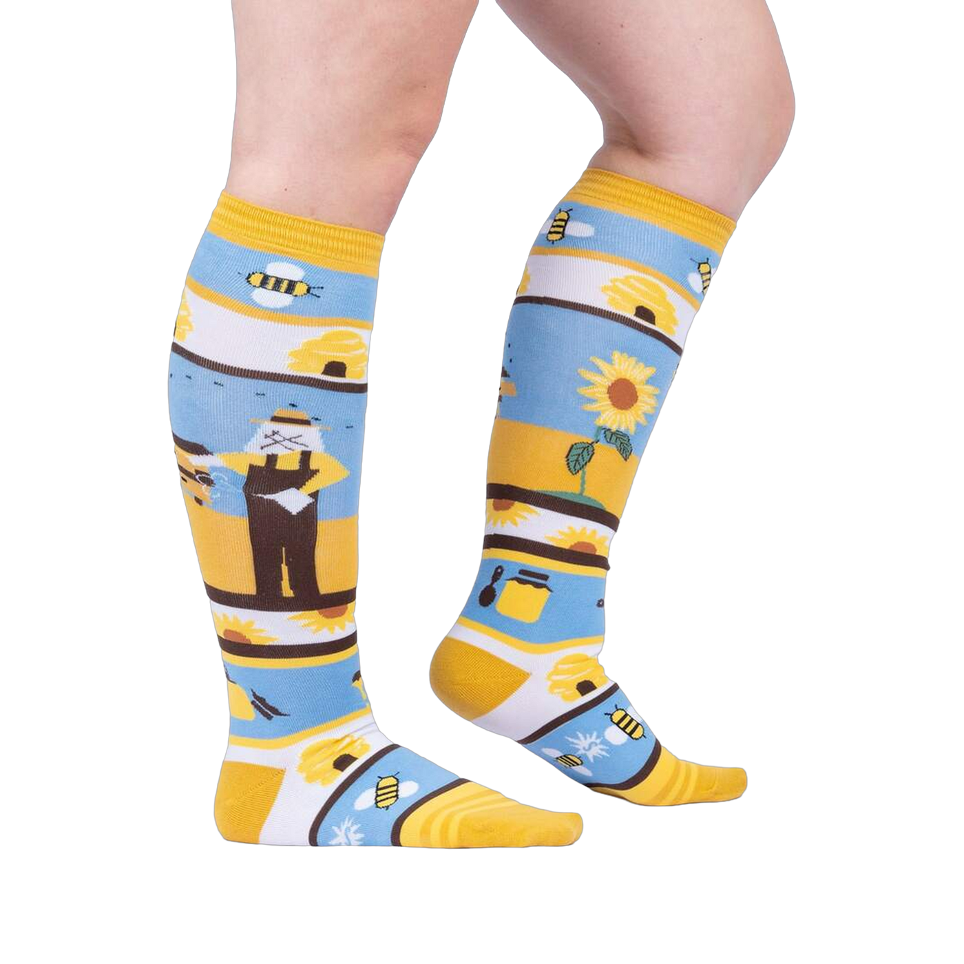 Lifestyle shot: A model's legs wearing the 'Honey, You're a Keeper' knee-high socks.