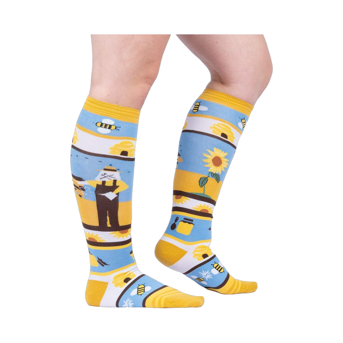 Lifestyle shot: A model's legs wearing the 'Honey, You're a Keeper' knee-high socks.