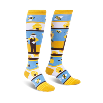 yellow knee-high socks with blue stripes and a bee-themed pattern including bees, sunflowers, a beekeeper, and a beehive for women.  