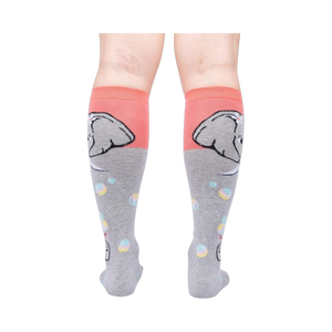Rear view of a pair of grey and coral knee-high socks with an elephant and bubble design.