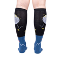Rear view of Disco Nut! socks on a person's legs; highlighting the full sock design and color scheme.