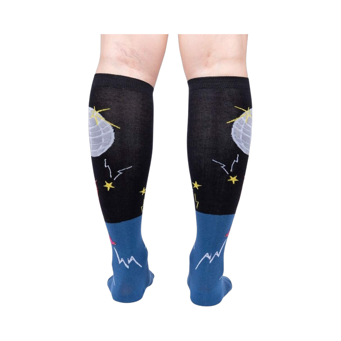 Rear view of Disco Nut! socks on a person's legs; highlighting the full sock design and color scheme.