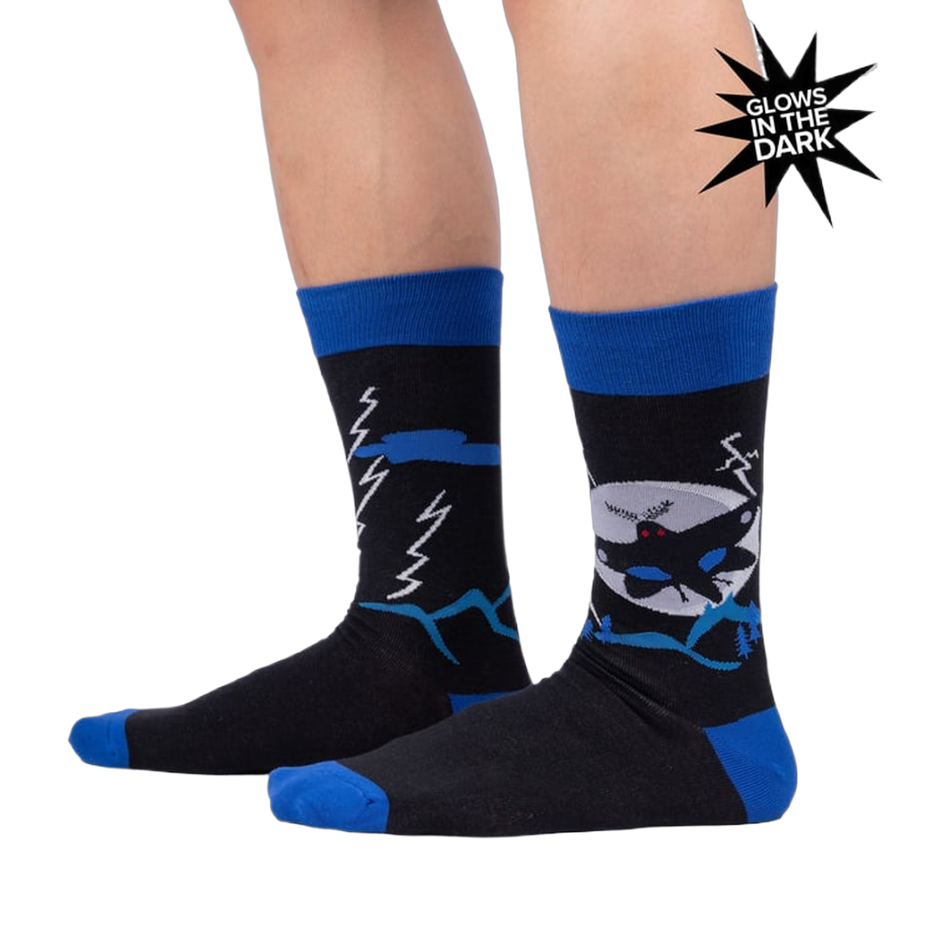 Lifestyle photo showing the socks on a person's legs, highlighting their fit and glow-in-the-dark feature.